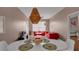 Open dining area with a round table and red couches visible in the background at 3190 Dante Dr # 304, Orlando, FL 32835