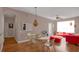 Dining area with hardwood floors and modern light fixture at 3190 Dante Dr # 304, Orlando, FL 32835