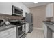 Modern kitchen with stainless steel appliances at 3190 Dante Dr # 304, Orlando, FL 32835