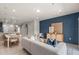 Bright living room features an open floor plan, connecting to the kitchen and dining areas at 3328 Pondside Way, Sanford, FL 32773