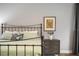 Elegant Primary bedroom with metal bed frame and nightstand at 3738 Chaplain Rd, Saint Cloud, FL 34772