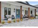 Inviting front porch with wooden posts and seating area at 3738 Chaplain Rd, Saint Cloud, FL 34772