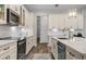 Clean kitchen featuring white cabinetry and quartz countertops at 3738 Chaplain Rd, Saint Cloud, FL 34772