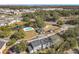 Aerial view showing community pool, clubhouse, and townhouses at 4408 Sun Village Blvd, Kissimmee, FL 34746