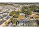 Aerial view of townhouses, pool, and surrounding neighborhood at 4408 Sun Village Blvd, Kissimmee, FL 34746