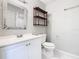 Clean bathroom with white vanity and mosaic mirror at 4408 Sun Village Blvd, Kissimmee, FL 34746