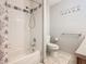 Bathroom with shower/tub combo and patterned curtain at 4408 Sun Village Blvd, Kissimmee, FL 34746