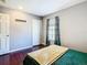 Cozy bedroom with wood floors and window at 4408 Sun Village Blvd, Kissimmee, FL 34746