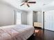 Bright bedroom with wood floors and ceiling fan at 4408 Sun Village Blvd, Kissimmee, FL 34746