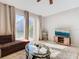 Spacious living room with sliding glass doors to backyard at 4408 Sun Village Blvd, Kissimmee, FL 34746