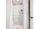 White marble shower with pebble floor at 4408 Sun Village Blvd, Kissimmee, FL 34746