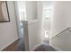 View of carpeted staircase with windowed landing at 543 Zinfandel Dr, Holly Hill, FL 32117