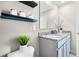 Bathroom with granite countertop, double vanity, and modern fixtures at 545 Zinfandel Dr, Holly Hill, FL 32117