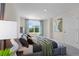 Main bedroom with large window, plush bed, and ample space at 545 Zinfandel Dr, Holly Hill, FL 32117
