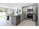 Modern kitchen with stainless steel appliances and granite countertops at 545 Zinfandel Dr, Holly Hill, FL 32117