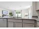 Kitchen island with granite countertop and modern sink at 545 Zinfandel Dr, Holly Hill, FL 32117