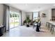Living room with a comfy couch and access to backyard patio at 545 Zinfandel Dr, Holly Hill, FL 32117