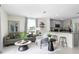 Open living space with modern furniture and kitchen bar at 545 Zinfandel Dr, Holly Hill, FL 32117