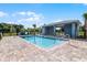 Community pool with a covered patio area at 545 Zinfandel Dr, Holly Hill, FL 32117
