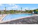 Community pool with a surrounding patio area at 545 Zinfandel Dr, Holly Hill, FL 32117