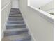 Carpeted staircase leading to the upper level of the home at 545 Zinfandel Dr, Holly Hill, FL 32117