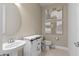 Small bathroom with a toilet, sink, and decorative wall art at 6018 Forest Perch Dr, St Cloud, FL 34771