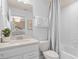 Clean bathroom with white subway tiles, a tub, and a vanity with a quartz countertop at 6018 Forest Perch Dr, St Cloud, FL 34771