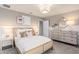 Cozy bedroom with a queen-size bed and neutral decor at 6018 Forest Perch Dr, St Cloud, FL 34771
