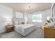 Spacious bedroom with a king-size bed and neutral color palette at 6018 Forest Perch Dr, St Cloud, FL 34771