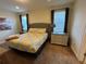 King-size bed, dresser, and window in bedroom at 7609 Brookhurst Ln, Kissimmee, FL 34747