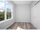 Bright bedroom with gray walls, wood-look floors, and a large window at 765 6Th Ave, Osteen, FL 32764