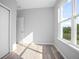 Bright bedroom with wood-look floors and large window at 765 6Th Ave, Osteen, FL 32764