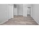 Spacious bedroom with wood-look floors and access to bathroom at 765 6Th Ave, Osteen, FL 32764