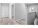 Light gray hallway with wood-look floors at 765 6Th Ave, Osteen, FL 32764