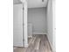 Clean hallway with light grey walls and wood-look flooring at 765 6Th Ave, Osteen, FL 32764