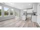 Bright kitchen featuring white cabinets and granite countertops at 765 6Th Ave, Osteen, FL 32764