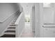 Modern staircase with dark wood steps and a white railing at 765 6Th Ave, Osteen, FL 32764