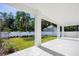 Covered patio with white tile flooring overlooks a grassy backyard at 812 Montana St, Orlando, FL 32803