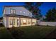 Two-story house with covered patio, lit at dusk at 812 Montana St, Orlando, FL 32803