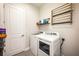 Convenient laundry room with washer, dryer, and extra storage at 8264 Canetti St, Orlando, FL 32827