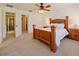 Bright bedroom with ensuite bathroom and ceiling fan at 446 Penny Royal Pl, Oviedo, FL 32765