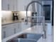 Stainless steel kitchen sink with a modern faucet at 11209 Lemon Lake Blvd, Orlando, FL 32836