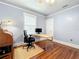 Home office with hardwood floors, large window, and built-in desk at 1406 S Osceola Ave, Orlando, FL 32806