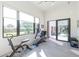 Bright home gym with various exercise machines and backyard access at 1410 Shady Meadow Ln, Deland, FL 32724