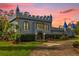 Enchanted castle exterior at sunset with unique landscaping at 14502 Scotch Pine Ct, Orlando, FL 32832