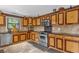 Kitchen with stainless steel appliances and wood cabinets at 14502 Scotch Pine Ct, Orlando, FL 32832