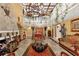 Magnificent living room with high ceilings, chandelier, and a cozy fireplace at 14502 Scotch Pine Ct, Orlando, FL 32832