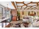 Home office with a custom ceiling, built-in desk, and comfortable seating at 14502 Scotch Pine Ct, Orlando, FL 32832