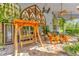 Covered patio with wooden swing, seating area, and brick flooring at 14502 Scotch Pine Ct, Orlando, FL 32832