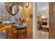 Unique powder room with a rustic sink and decorative metal wall at 14502 Scotch Pine Ct, Orlando, FL 32832